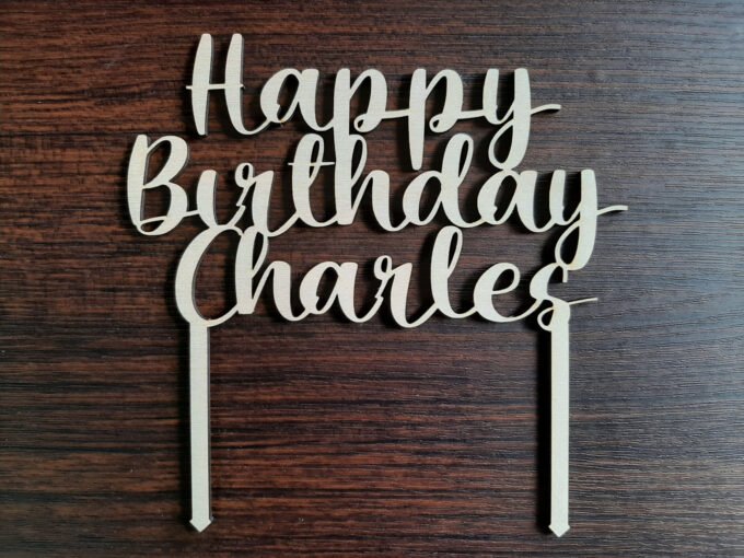 Happy Birthday cake topper decoration which says Happy Birthday Charles