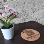 Drink's coaster with QR code on a cafe table