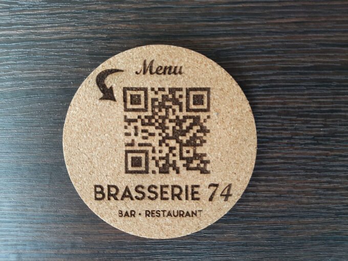 Customised drink's coaster made from cork material. Contains QR code and business name