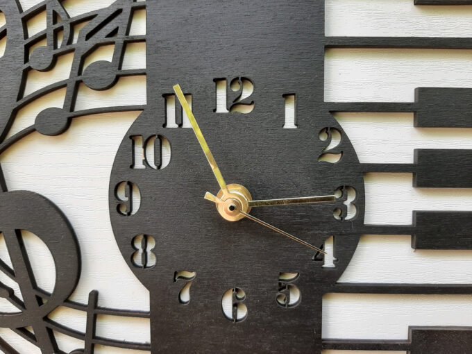 Clock face of piano themed wall clock