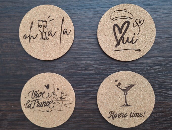 Four drink coasters beer mats with France theme motifs