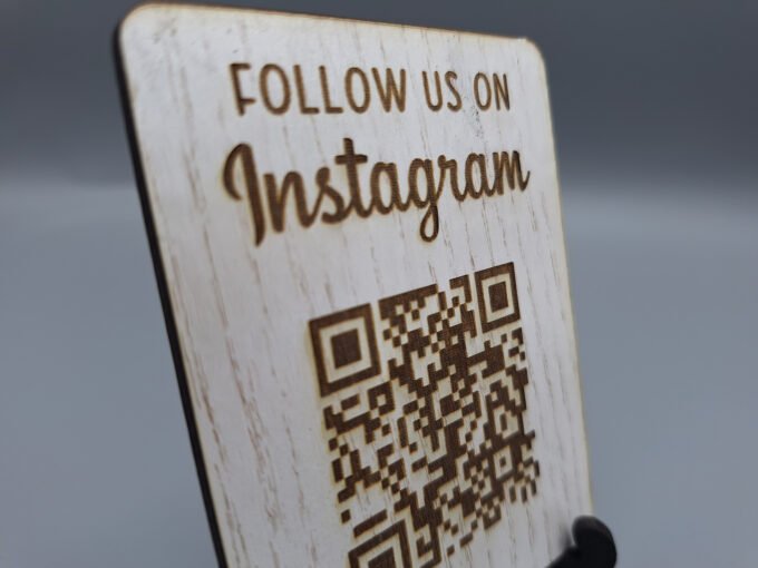 Close up view of white wood effect design personalised QR code sign