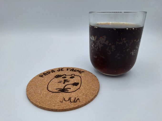 Drink coaster beer mat with personalised art drawing and text message.