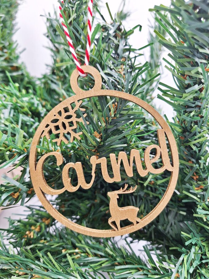 Personalised Christmas decoration hanging on Christmas tree